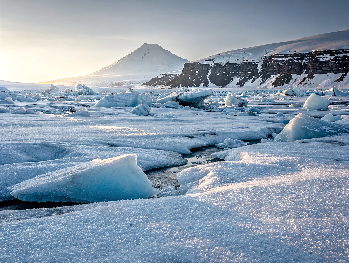 Transparent turquoise ice blocks stacked under clear Siberian winter sky